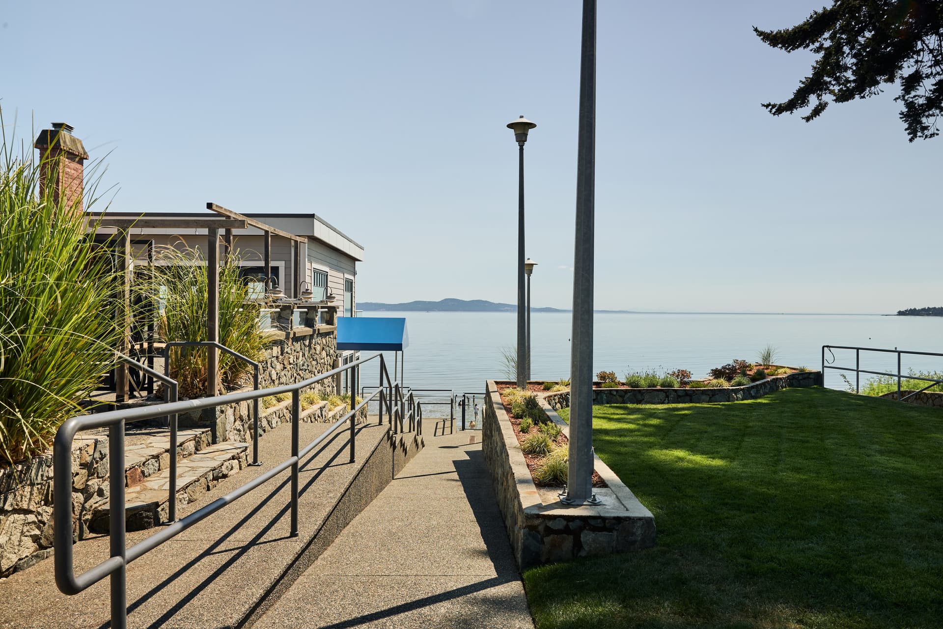 Scenic waterfront pathway leading to the café with ocean views